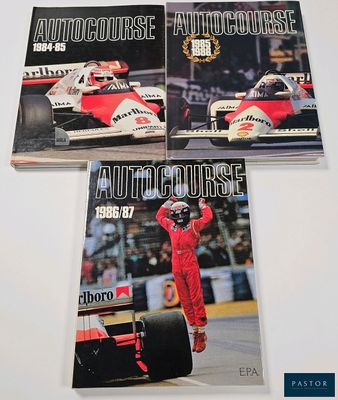 three autocrosse magazine covers on a table with a man in a racing suit