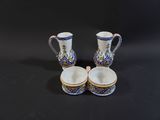 pair of blue and white vases on a black background