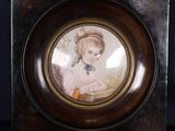 a picture of a little girl in a picture frame