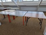 three tables that are sitting in a room