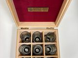 a wooden box with six different types of wine glasses in it
