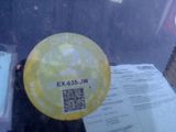 a sticker on the windshield of a car with a qr code on it