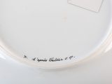 a close up of a plate with a tag on it