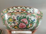 a person holding a bowl and a bowl with flowers on it