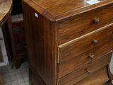 an image of a wooden dresser in a room