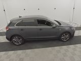 an image of a grey car parked in a garage