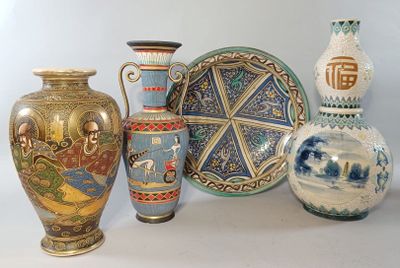 four vases sitting next to each other on a table