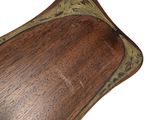a wooden tray with a decorative design on it