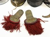 two pairs of shoes with red tassels on them