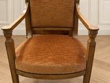 a chair that is sitting in a room on a hard wood floor