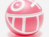 une balle rose et blanche sur laquelle est dessiné un smiley