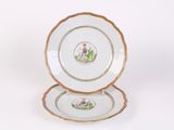 two plates that are sitting side by side on a white surface