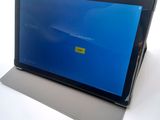 a tablet computer with a blue screen on it