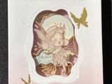 a picture of a box with a picture of a fairy on it