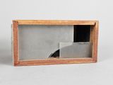 a picture of a small wooden box with a picture inside of it
