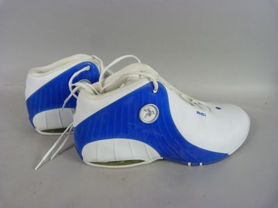 pair of blue and white shoes with white laces on them