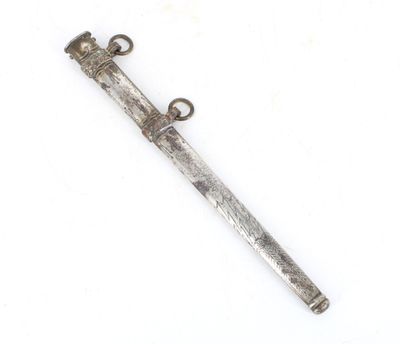 an old silver dagger with a metal handle on a white surface