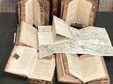 several open books sitting on top of a table next to each other