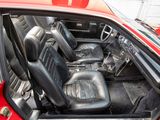 a red car with black seats in the back of it