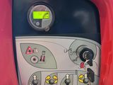 a close up of a control panel in a red vehicle