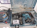 a tool box with a drill and other tools in it