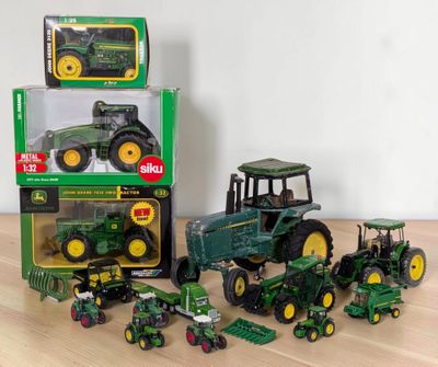 a lot of toy tractors that are on the table