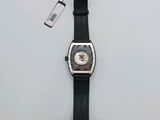 a watch that is sitting on a white surface