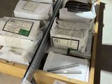 many boxes of papers and other items on a shelf