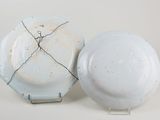 a white plate and a white plate with a wire around it