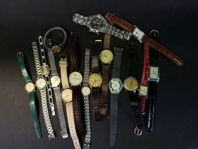 a lot of watches that are sitting together on the table