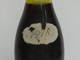 a bottle of wine that is sitting on a table