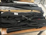 several umbrellas are lined up on a table in a room