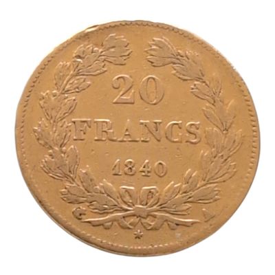 une vieille pièce française de 20 francs sur fond blanc