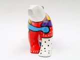 a ceramic bear with polka dots on it ' s legs