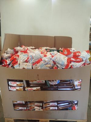 a cardboard box filled with candy and candy bars