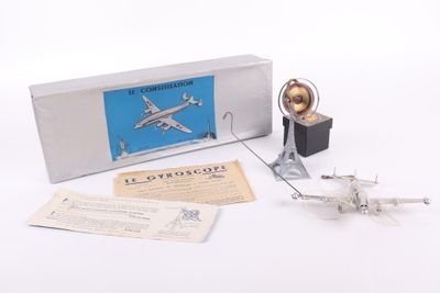 a small model of an airplane with a box on the table
