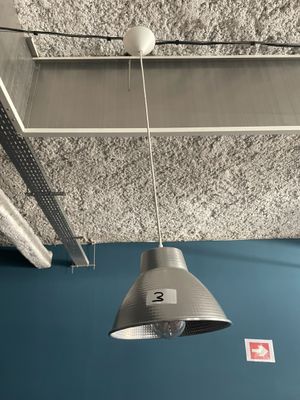 a light that is hanging from the ceiling in the room