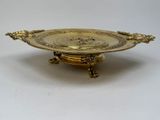 an image of a gold plate with a lion on it