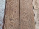 two pieces of wood sitting on the floor next to each other