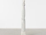a white sculpture in a room with a white wall and floor