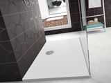 a shower with a glass door in a bathroom