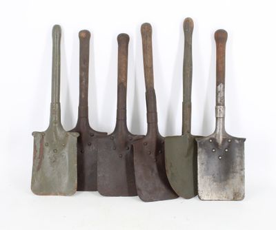 five different types of garden tools are lined up against a white background