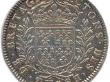 a silver coin with a crown on top of it