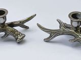 pair of antique silver plated candlesticks with birds on them