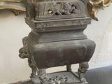 a statue of a bird sitting on top of a table