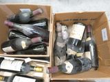 many bottles of wine in a box on the floor