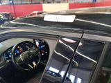 a car with a sticker on the dashboard of it