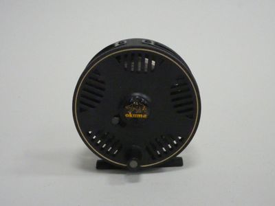 an image of a close up of a small black object on a white surface