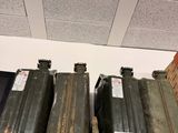a shelf that has a bunch of old suitcases on it