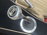 a close up of a car ' s interior with a gear stick